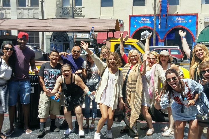 Explore the iconic sights of LA with friends capturing memories at landmarks like Hollywood Boulevard and Santa Monica Pier while soaking in the lively spirit of the city.